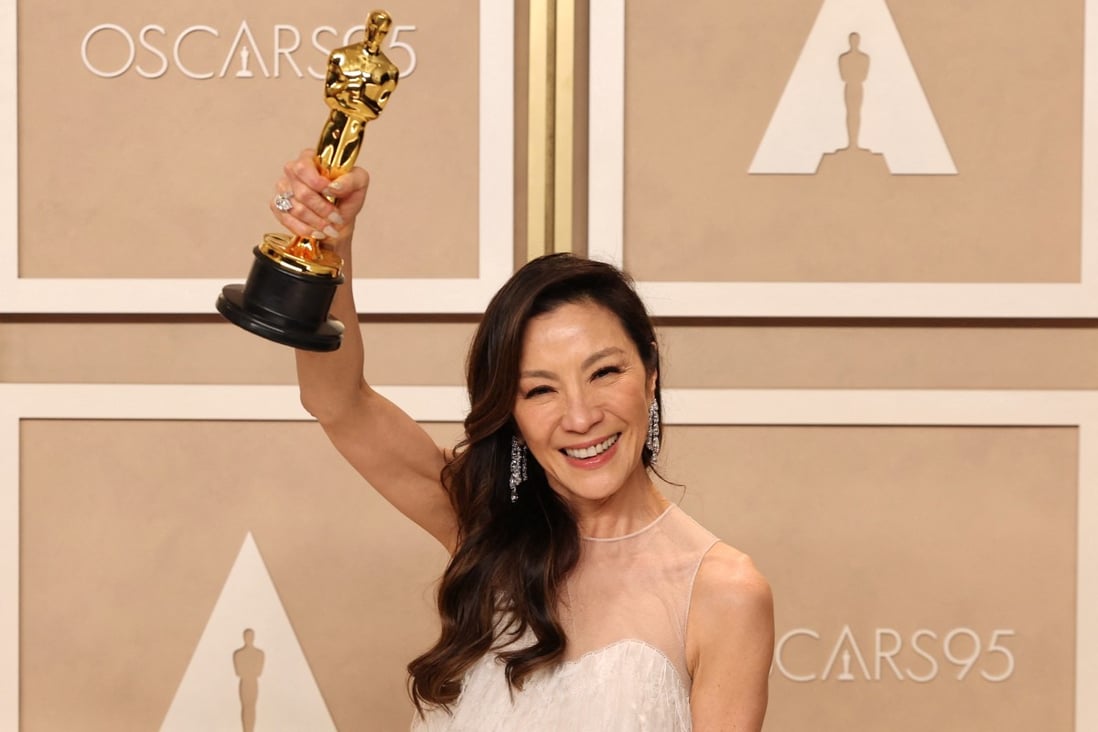 Michelle Yeoh poses with her best actress Oscar backstage at the Dolby Theatre in Los Angeles. The Everything Everywhere All at Once actress is the first who identifies as Asian to win the award in 95 years of the Academy Awards. Photo: Reuters 