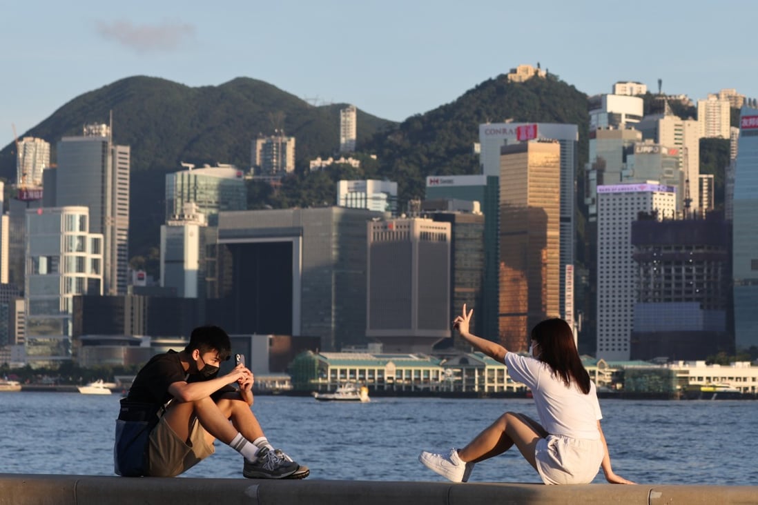 Two young people take a photo at the West Kowloon waterfront promenade in June last year. Like the cohorts before them, today’s youth are worried about ageing populations, resource shortages, climate change and inequalities. Photo: Edmond So
