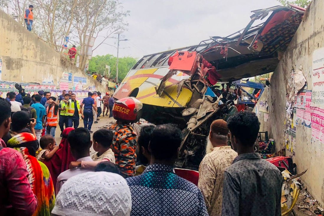 People gather after a fatal bus crash in Bangladesh on Sunday. Photo: AFP