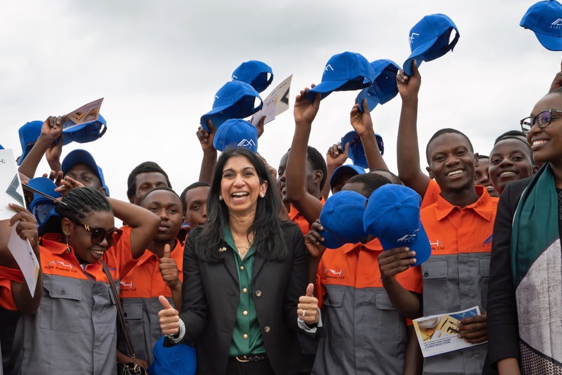 UK Home Secretary Suella Braverman meets graduate builders in Kigali, Rwanda on Saturday. The graduates will be helping to construct houses that could house deported migrants from the UK. Photo: PA Wire / dpa