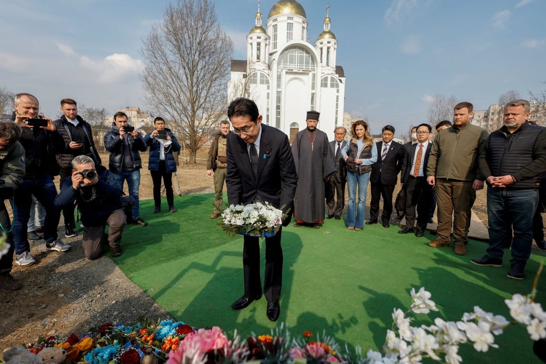 Japanese Prime Minister Fumio Kishida visits a mass grave in Ukraine’s Bucha on March 21. Photo: Reuters