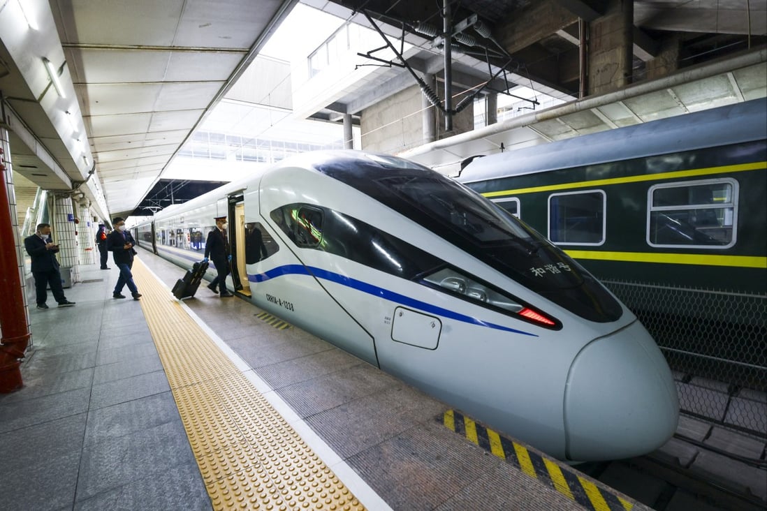 Passengers board the train bound for Hong Kong at Guangzhoudong Railway Station. Photo: Dickson Lee