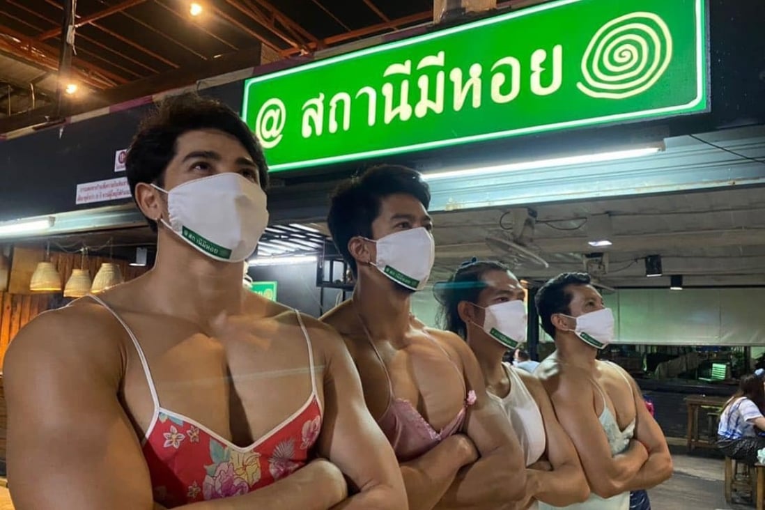 Members of the Thai Hot Guys pose outside a restaurant in Bangkok. Photo: Facebook/Malaysia Pub