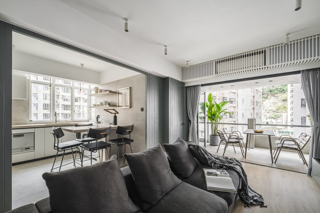 A family happily downsized to move into this EMCS-designed flat in Happy Valley, complete with an open-air dining area on a balcony and large windows. Photo: Ken Wong