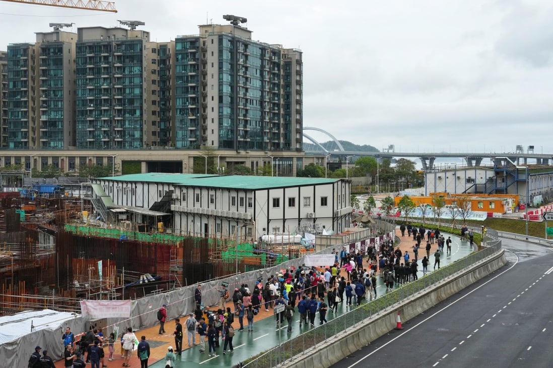 Protesters march in wet weather in Tseung Kwan O to voice their opposition against reclamation plans and the building of refuse facilities on such land. Photo: Elson Li