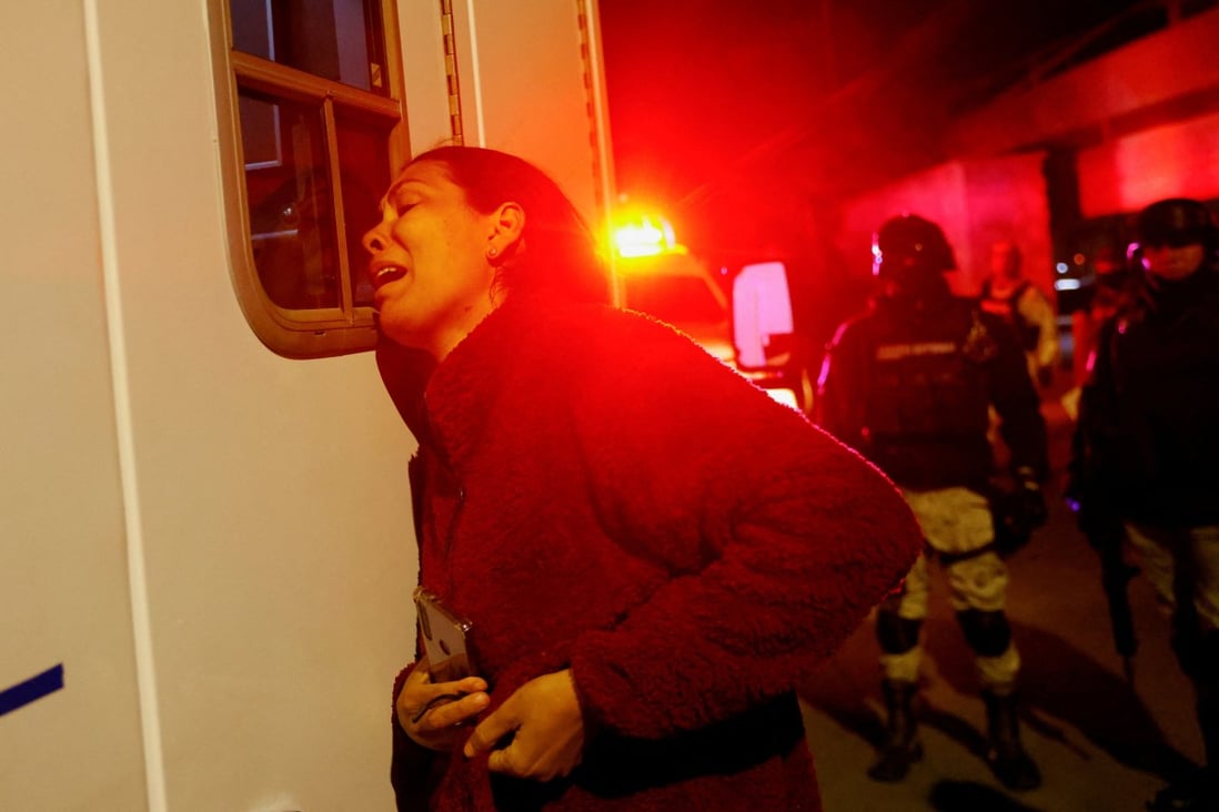 A Venezuelan migrant reacts after her husband was injured during a fire in Ciudad Juarez, Mexico, on Monday. Photo: Reuters