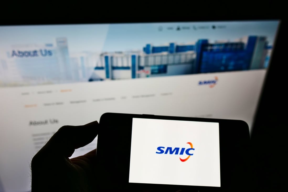 A smartphone shows Semiconductor Manufacturing International Corp's logo in front of the Chinese chip foundry's website. Photo: Shutterstock 