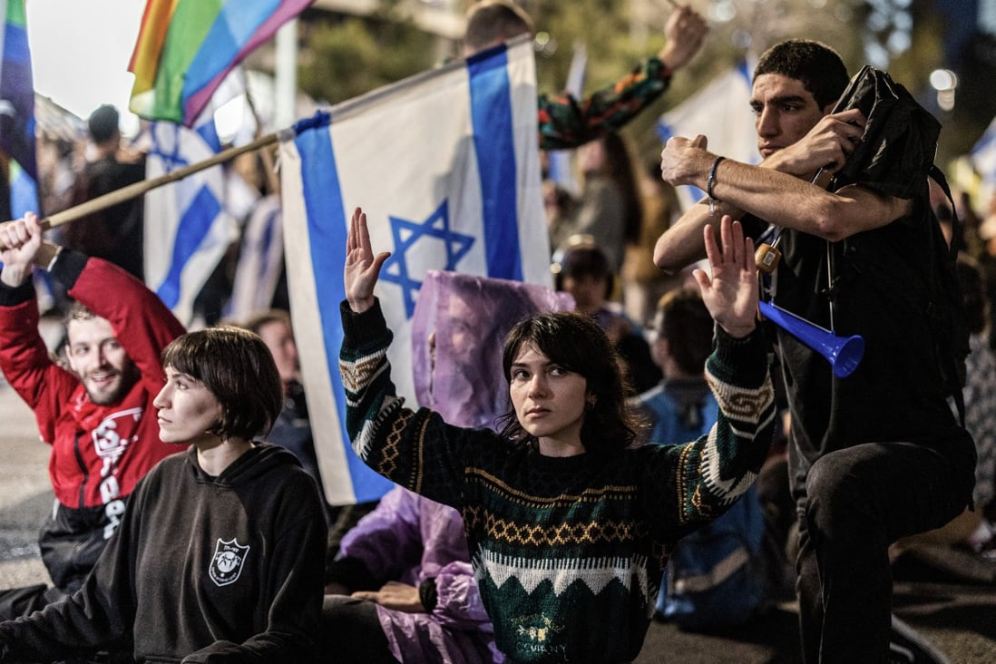 Hundreds of thousands of Israelis protest despite delay to judicial