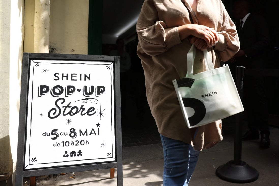A woman leaves a pop-up store of fast-fashion retailer Shein in Paris on May 5, 2023. Photo: Reuters
