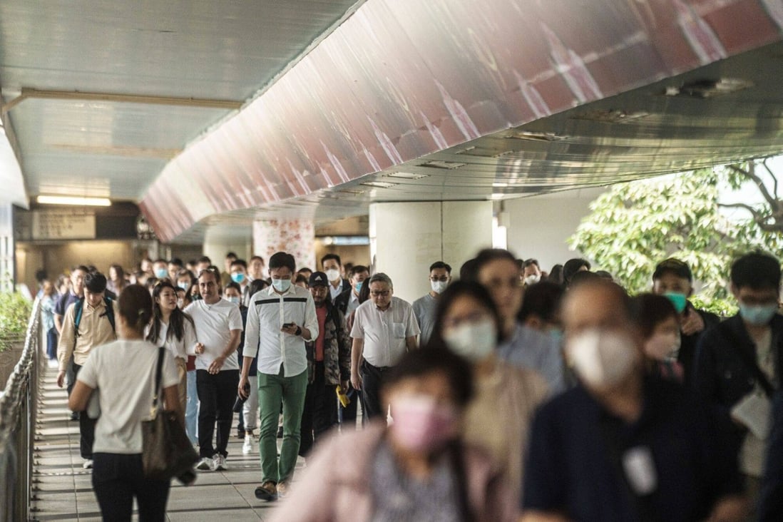Pedestrians on a footbridge in Hong Kong on April 24. Although Hong Kong’s literacy rate and tertiary education coverage are among the highest in the world, this has not necessarily translated into growing earning potential. Photo: Bloomberg 