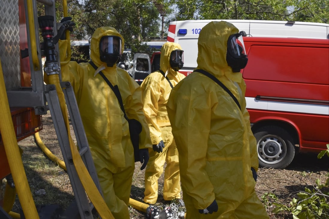 Ukrainian emergency workers wearing radiation protection suits attend training in Zaporizhzhia, Ukraine, on June 7. The nine nuclear-armed states continued to modernise their nuclear arsenals and several deployed new nuclear-armed or nuclear-capable weapon systems in 2022, according to the Stockholm International Peace Research Institute. Photo: AP