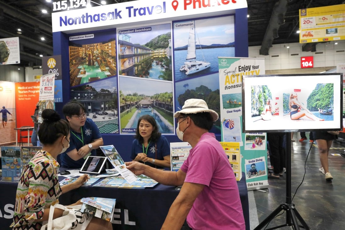 Visitors check travel deals at a travel and tourism fair in Bangkok on June 29. The tourism and travel fair featured hundreds of exhibitors from tour operators, hotels and travel agencies offering discounts in an attempt to revive the country’s tourism industry and boost its economy. Photo: EPA-EFE