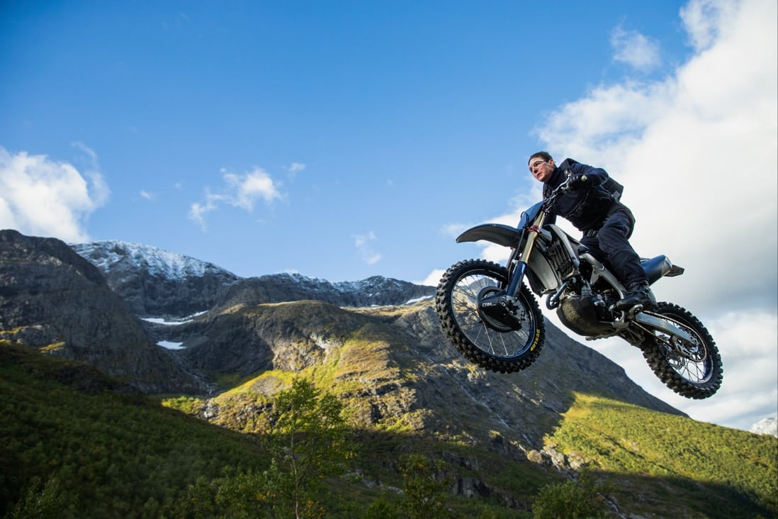 Mission: Impossible – Dead Reckoning Part One movie Tom Cruise riding motorcycle from a cliff
