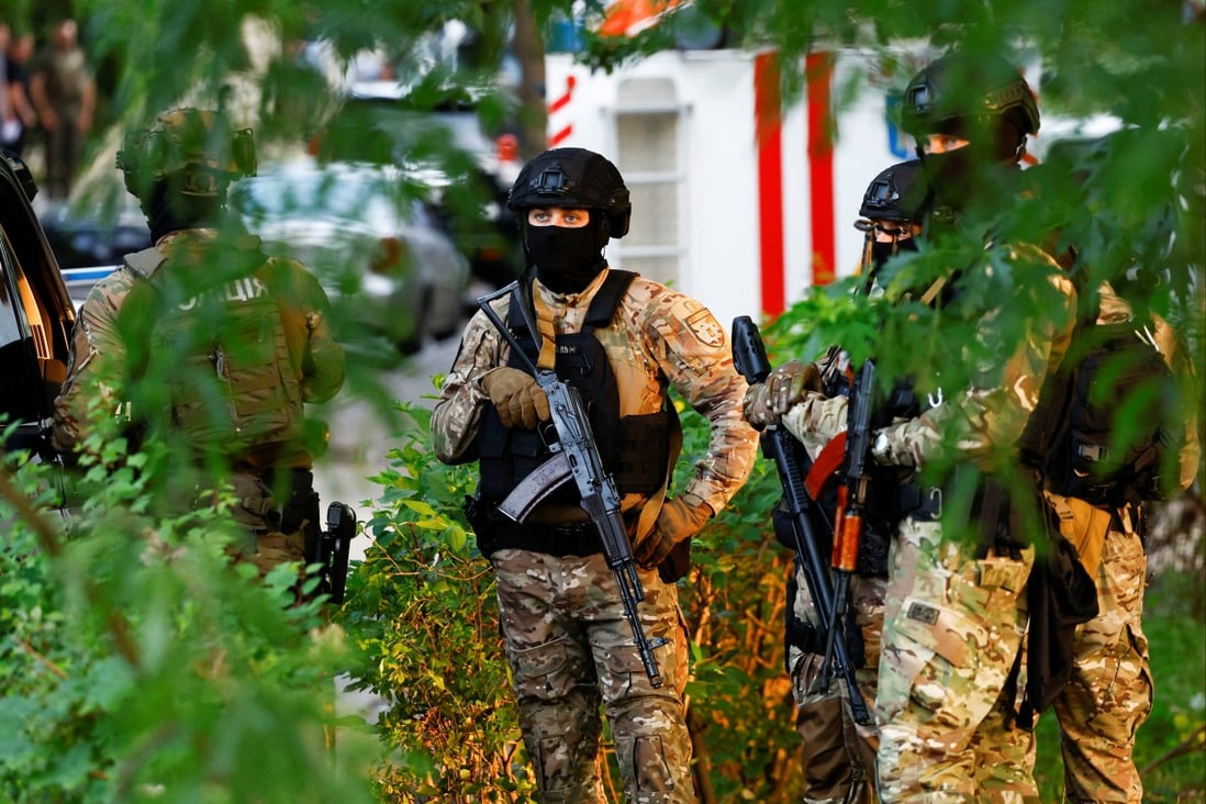 Police special operations team members are seen at the site of a Kyiv district court where an explosive device had been detonated on Wednesday. Photo: Reuters