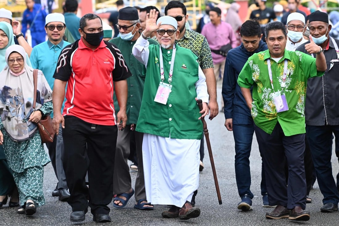 PAS President Abdul Hadi Awang waves during Malaysia’s general election last year. How well will the conservative party do in August’s state elections? Photo: Malaysia’s Department of Information via AFP