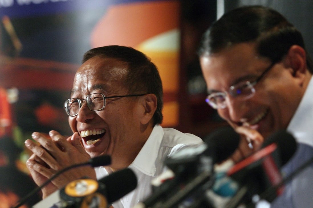 Billionaire Ong Beng Seng (left) and Singapore minister S Iswaran in 2007. Photo: EPA-EFE