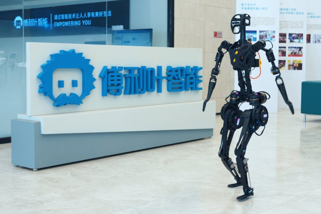 Fourier Intelligence’s GR-1 robot walks past the company logo at its headquarters in Shanghai. Photo: Handout