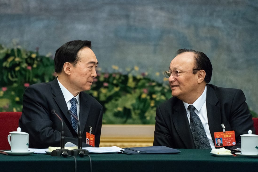 Xinjiang party boss Chen Quanguo (left) and the region’s chairman Shohrat Zakir attend a panel discussion in Beijing on Tuesday. Photo: EPA-EFE