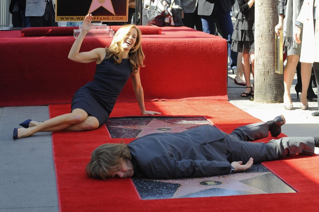 Felicity Huffman and her husband William H. Macy pose at the Hollywood Walk of Fame after being awarded joint stars in 2012. Photo: Reuters