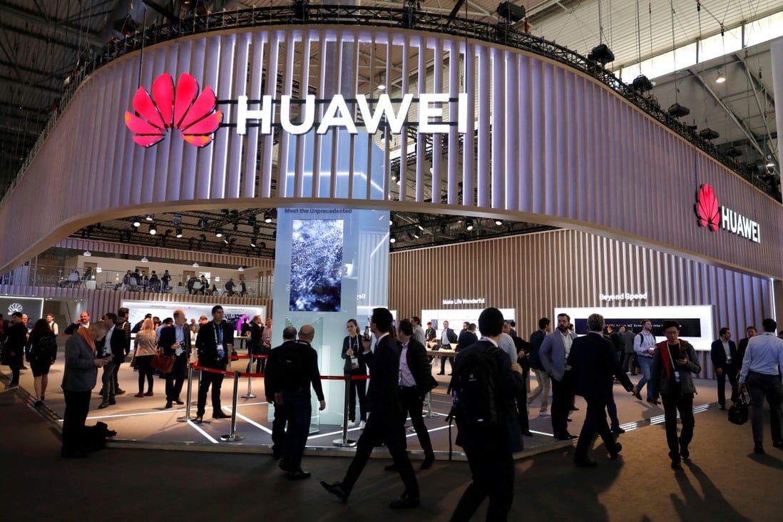 Visitors walk next to a Huawei booth at the Mobile World Congress in Barcelona, Spain, February 27, 2019. Photo: Reuters