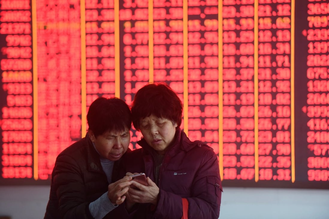 Investors at a stock exchange in Hangzhou on March 4, 2019. Contrary to global conventions, China’s stock market denotes gains and advances in red, while green is used to illustrate losses and declines. Photo: Xinhua