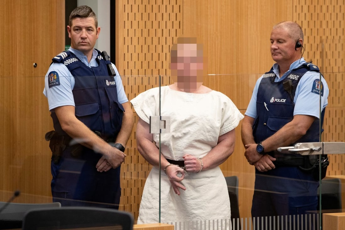 Brenton Tarrant, charged with murder, makes a hand gesture associated with white supremacy during his appearance in the Christchurch District Court in New Zealand. Photo: Reuters