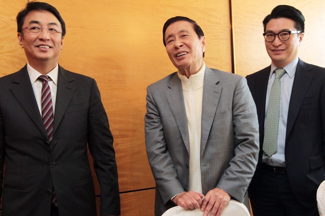 Henderson Land’s Lee Shau-kee is seen here with his sons Peter Lee Ka-kit, left, and Martin Lee Ka-shing, both vice-chairmen at the company. Lee suggested on Wednesday he was considering stepping down and handing control to his sons. Photo: Bruce Yan