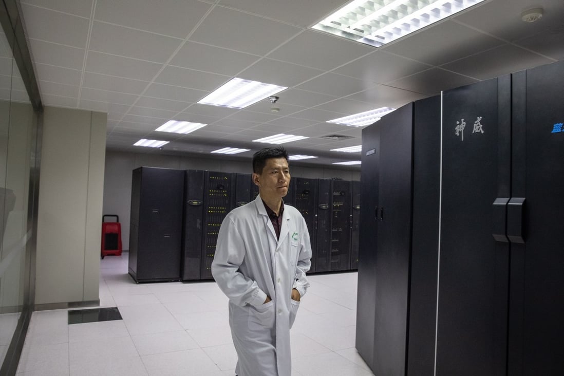 An employee walks next to supercomputers at The National Supercomputer Centre in Jinan, Shandong province, on October 17, 2018. Photo: EPA-EFE