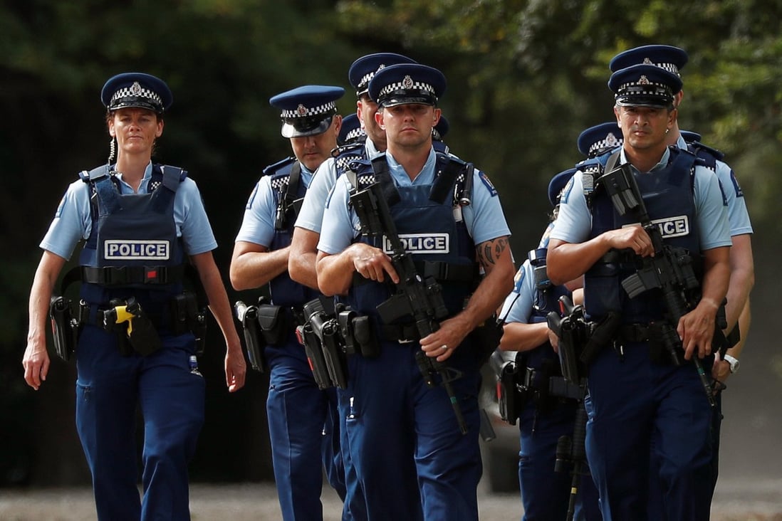 Armed police officers secure the perimeter before Friday prayers at Hagley Park. Photo: Reuters