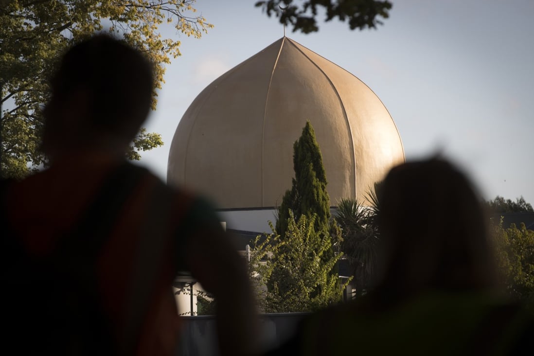 Mourners stand in front of Al Noor mosque in Christchurch, New Zealand. Photo: AP