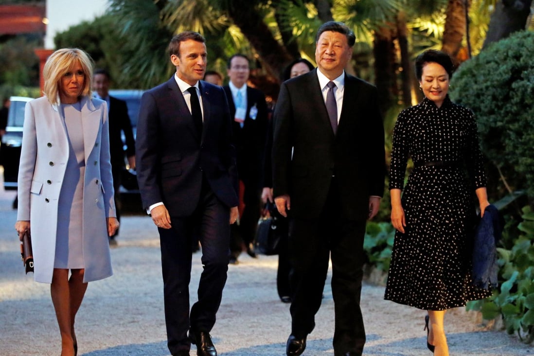 French President Emmanuel Macron and his wife, Brigitte, welcome Chinese President Xi Jinping and his wife, Peng Liyuan, as they arrive for a dinner at the Villa Kerylos in Beaulieu-sur-Mer, near Nice, France, on Sunday. Photo: EPA-EFE