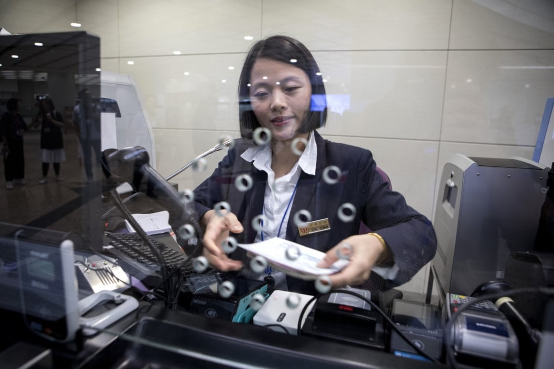 A ticket counter at the West Kowloon station of the Guangzhou-Shenzhen-Hong Kong Express Rail Link. Too few counters to deal with passengers transferring trains in mainland China can be a recipe for impatient customers and tired staff. Photo: Bloomberg