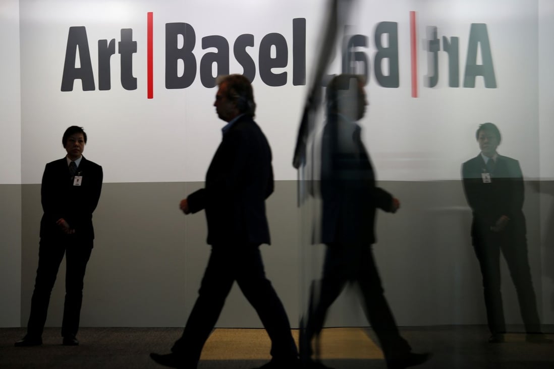 A guest attends the opening reception of Art Basel Hong Kong in 2018. For the VIPS of the art world, the fair is their biggest networking opportunity of the year in Asia. Photo: Reuters