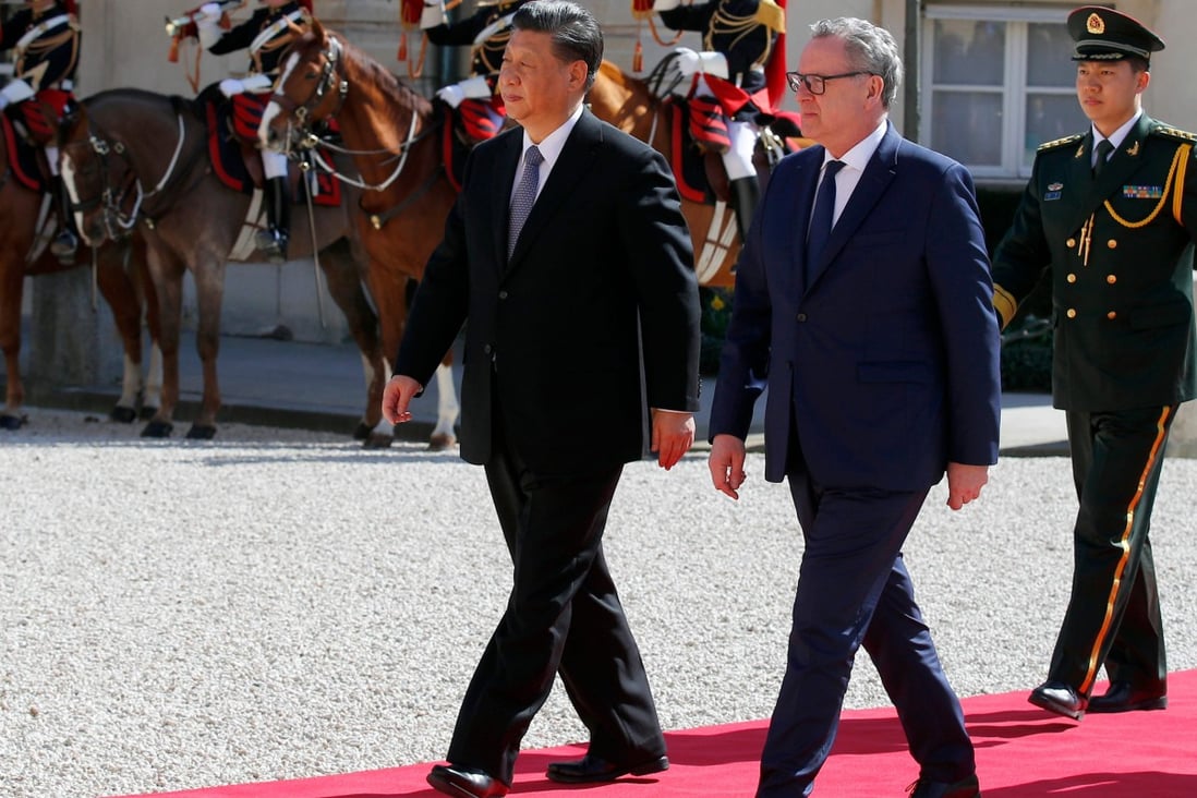 Chinese President Xi Jinping with French president of the National Assembly Richard Ferrand in Paris. Photo: AFP