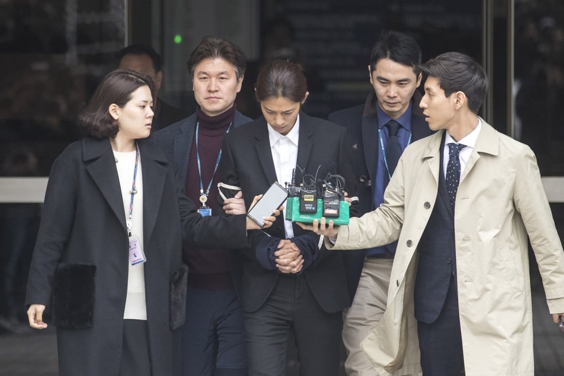 Jung Joon-young (centre), flanked by two policemen, attends court. Photo: EPA-EFE/Kim Chul-soo