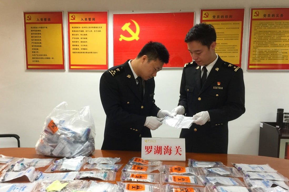 Customs officials in Shenzhen discovered 142 blood samples in a backpack carried by a 12-year-old girl. Photo: Luohu Port