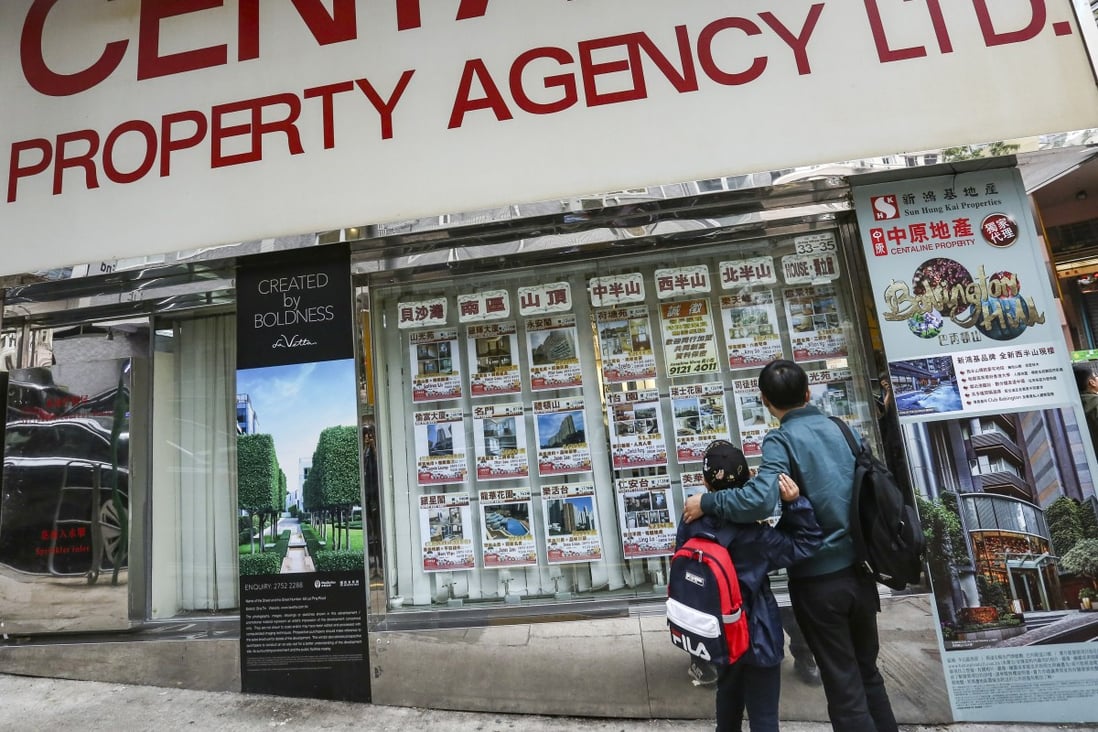 Property prices are listed at a real estate agency in Happy Valley. Photo: Jonathan Wong