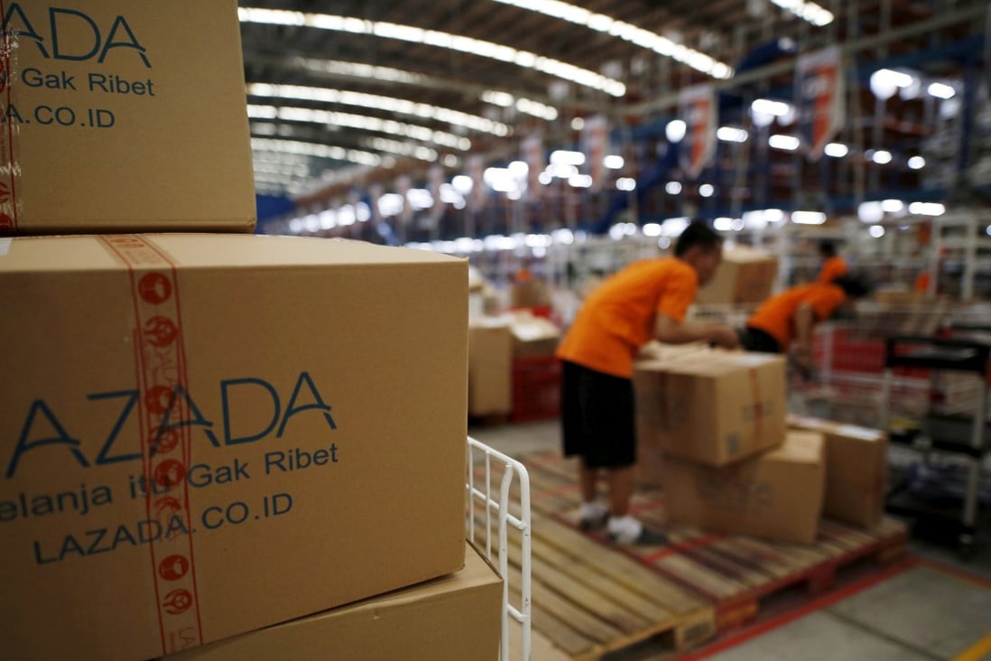 Employees at online retailer Lazada fill orders at the company's warehouse in Jakarta, Indonesia. Photo: Reuters