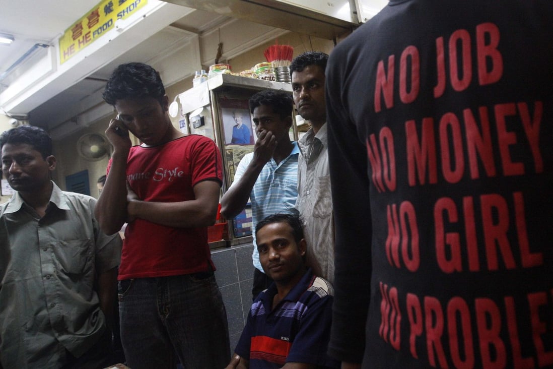 Labourers from Bangladesh at a coffee shop in Singapore’s Little India district. Photo: Reuters