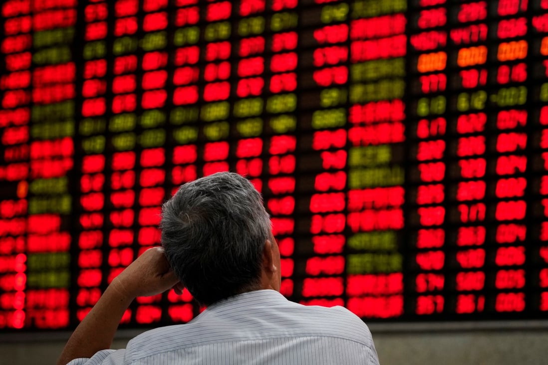 An investor studies stock prices at a brokerage house in Shanghai on September 7, 2018. Photo: Reuters