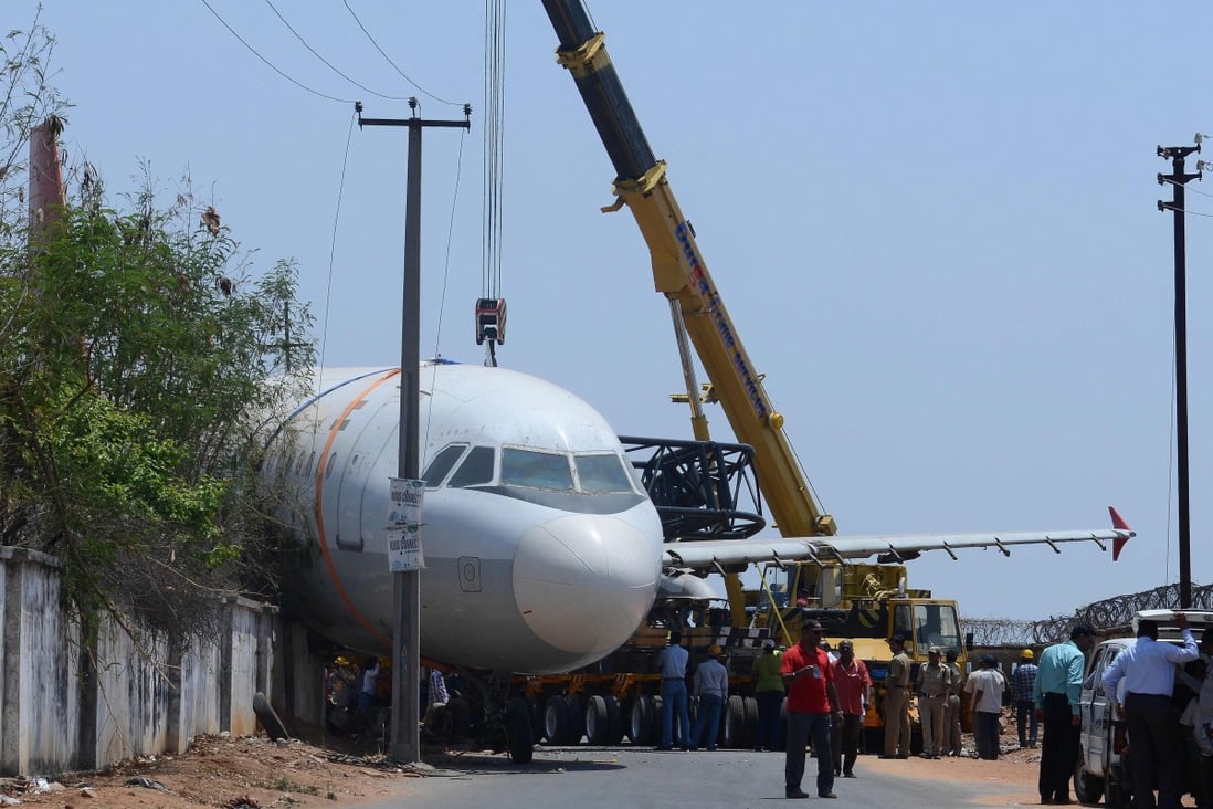 A disused Air India passenger plane which fell from a ground transporter while being moved near Begumpet Airport in Hyderabad. India’s aviation sector is going through a rough patch. Photo: AFP