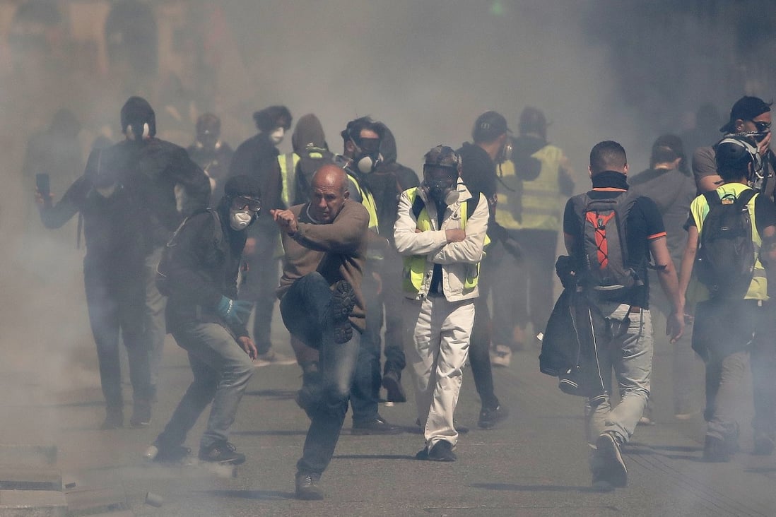 Protesters from the “Gilets Jaunes” (Yellow Vests) movement clash with French riot police in Toulouse, France, on Saturday. Photo: EPA-EFE