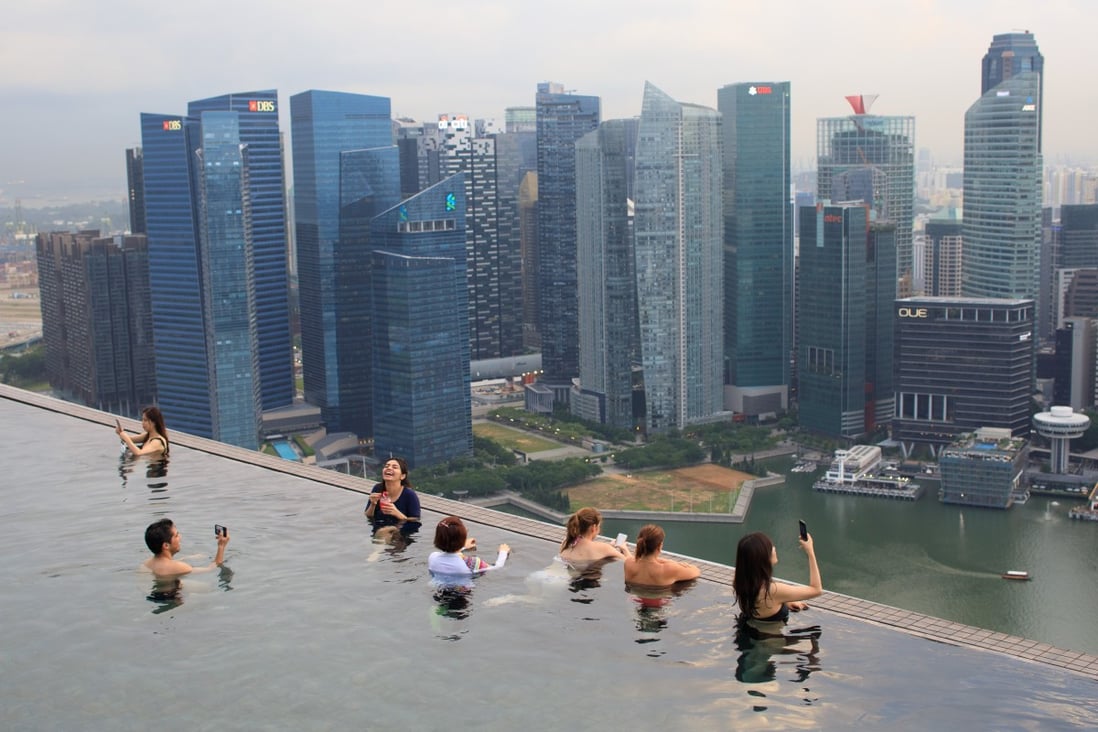 The rooftop pool of Marina Bay Sands in an area built on reclaimed land in Singapore. The land mass of Singapore has increased by about 22 per cent since independence in 1965. Photo: AFP
