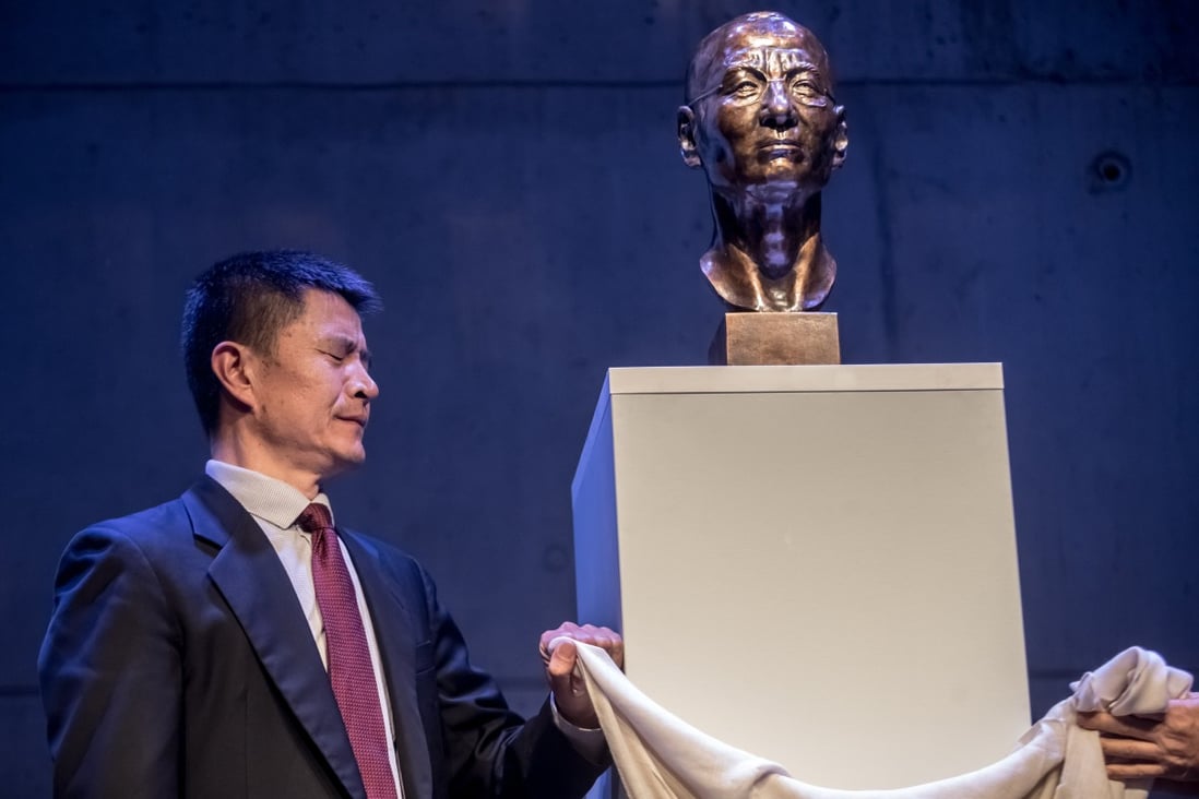 Zhou Fengsuo, a former Tiananmen student leader in 1989, unveiling the bust of Liu Xiaobo, Chinese Nobel Peace Prize winner, at the Dox Centre for Contemporary Art in Prague. Photo: EPA-EFE