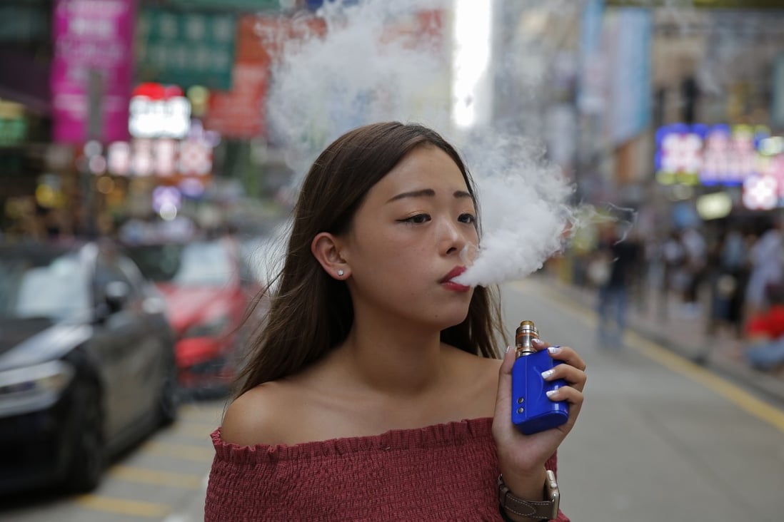 A young e-cigarette smoker in Hong Kong. The city plans to ban vaping and other new smoking products such as heat-not-burn tobacco. Photo: AP