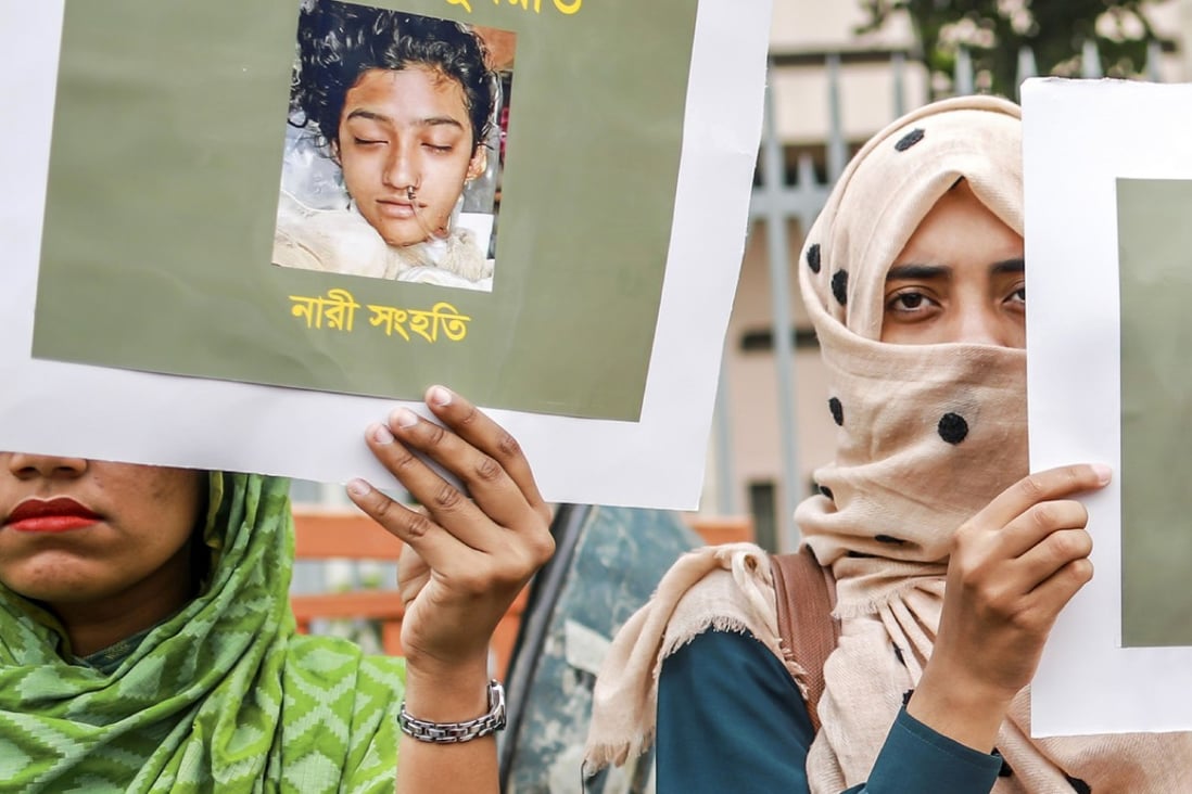 Bangladeshi women hold placards and photographs of schoolgirl Nusrat Jahan Rafi at a protest in Dhaka, following her murder. Photo: AFP