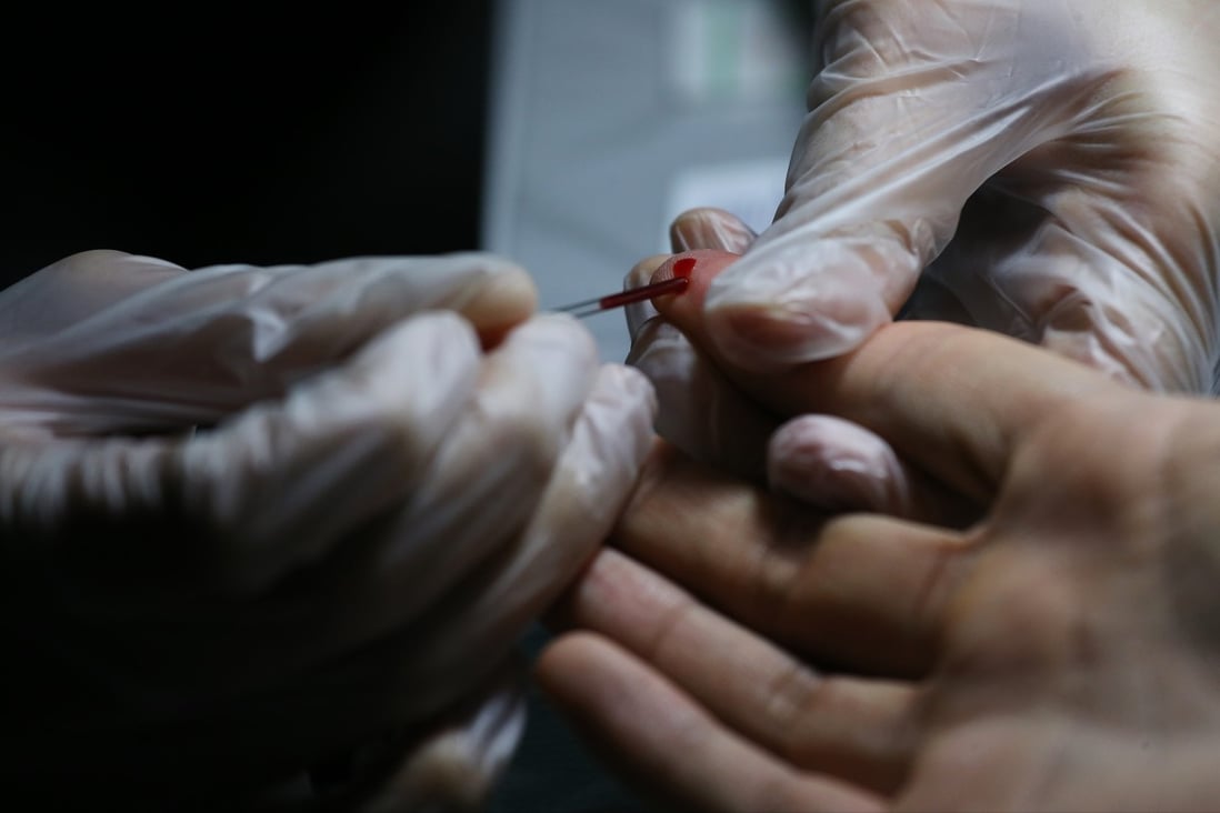 A rapid HIV test by finger prick. A New Zealand teacher has launched a legal challenge against South Korea’s government after she lost her job for refusing to take a HIV test. Photo: Dickson Lee