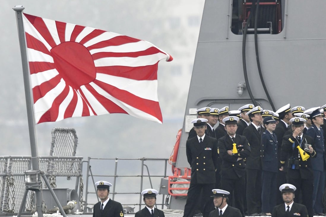 A Japanese Maritime Self-Defence Force ensign is flown on the deck of the destroyer Suzutsuki as it arrived at China's Qingdao port on April 21. Photo: Kyodo