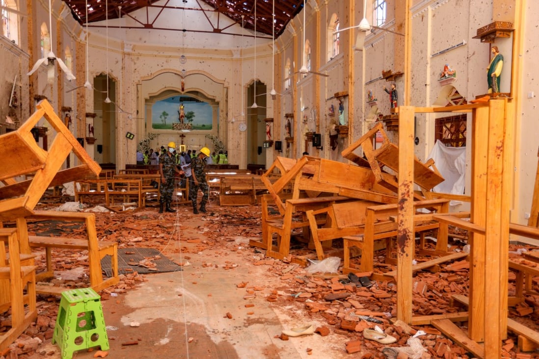 Sri Lankan soldiers inspect the damage following explosions at St. Sebastian's Church in Negombo. Photo: Bloomberg