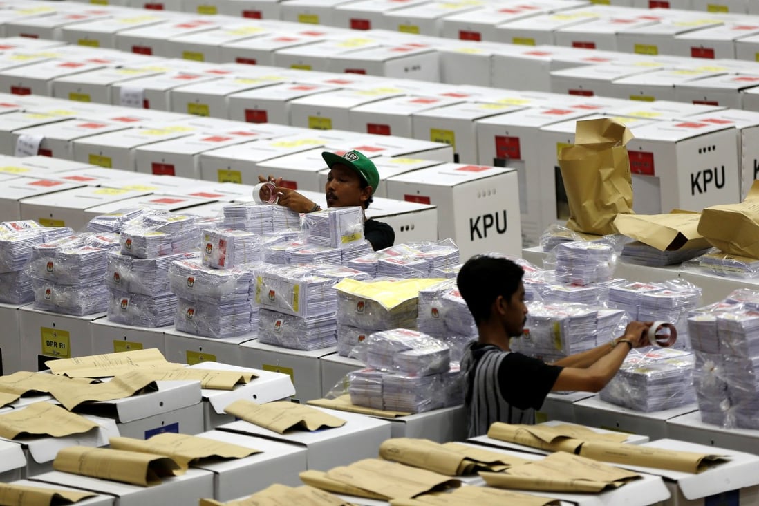 Workers prepare ballots for Indonesia’s election at a warehouse in Jakarta on April 15. Photo: Reuters